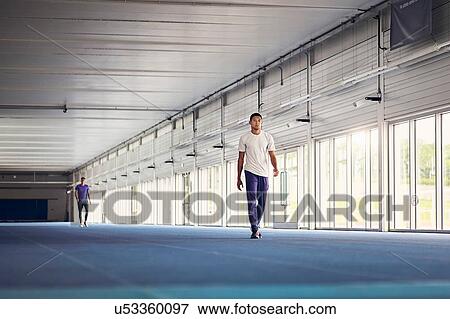 Runner training on indoor running track View Large Photo Image Stock Photo - Runner training on indoor running track. Fotosearch
