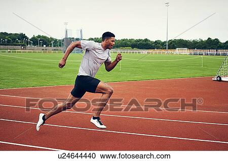 Runner training on running track View Large Photo Image Stock Image - Runner training on running track. Fotosearch