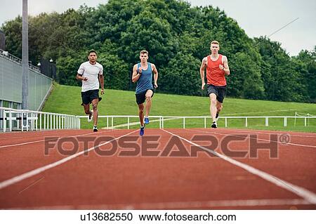 Runners training on running track View Large Photo Image Stock Image - Runners training on running track. Fotosearch