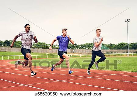 Runners training on running track View Large Photo Image Stock Image - Runners training on running track. Fotosearch