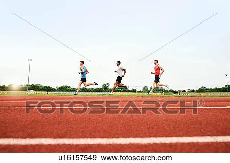 Stock Photo - Runners training on running track. Fotosearch