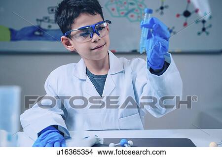 Picture - Schoolboy doing chemistry experiment. Fotosearch