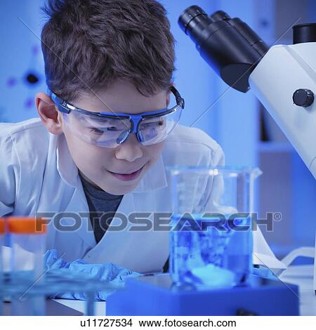 Picture - Schoolboy doing science experiment. Fotosearch