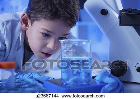 Picture - Schoolboy doing science experiment. Fotosearch