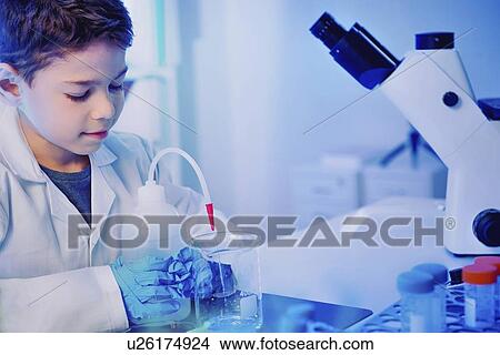 Schoolboy using lab equipment View Large Photo Image Picture - Schoolboy using lab equipment. Fotosearch