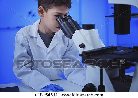 Schoolboy using light microscope View Large Photo Image Stock Image - Schoolboy using light microscope. Fotosearch