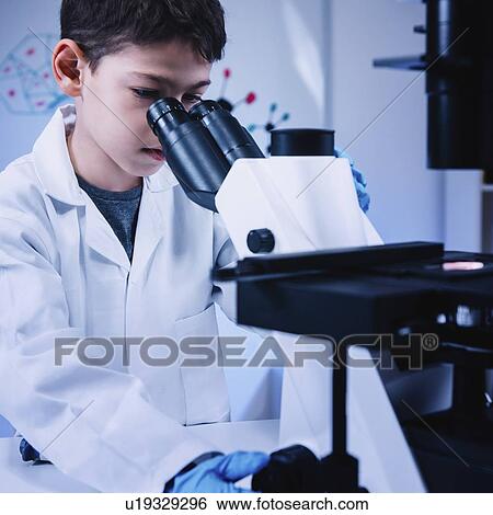 Schoolboy using light microscope View Large Photo Image Stock Photograph - Schoolboy using light microscope. Fotosearch