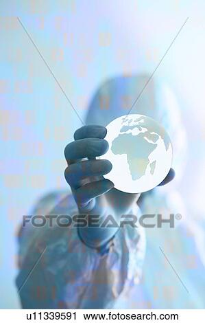 Scientist in protective clothing holding globe in his hand. View Large Photo Image Stock Image - Scientist in protective clothing holding globe in his hand.. Fotosearch