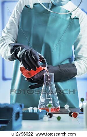Stock Image - Scientist working with biological samples. Fotosearch