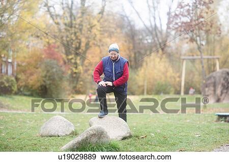 Senior woman exercising in park View Large Photo Image Stock Photo - Senior woman exercising in park. Fotosearch