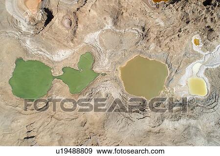 Stock Photo - Sink holes on sea shore, Dead Sea, Israel. Aerial photography with drone. Fotosearch
