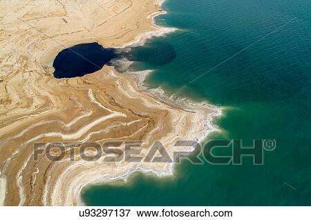 Stock Photo - Sink holes on sea shore, Dead Sea, Israel. Aerial photography with drone. Fotosearch