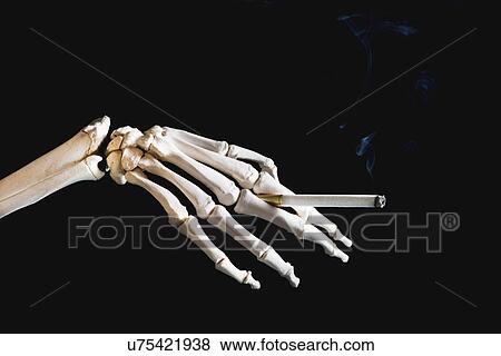 Stock Photo - Skeleton smoking. Fotosearch