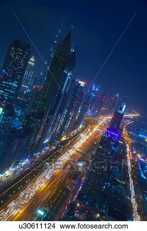 Skyscrapers along Sheikh Zayed Road at evening rush hour, Dubai, UAE View Large Photo Image Picture - Skyscrapers along Sheikh Zayed Road at evening rush hour, Dubai, UAE. Fotosearch