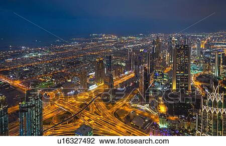Stock Image - Skyscrapers along Sheikh Zayed Road at evening rush hour, Dubai, UAE. Fotosearch