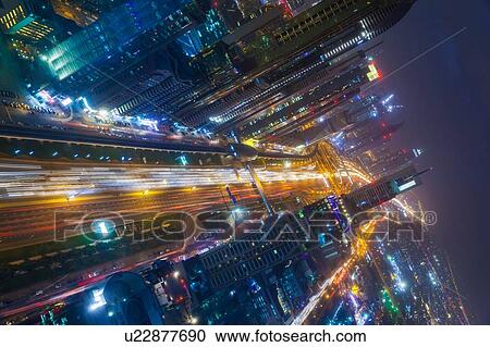 Skyscrapers along Sheikh Zayed Road at evening rush hour, Dubai, UAE View Large Photo Image Stock Image - Skyscrapers along Sheikh Zayed Road at evening rush hour, Dubai, UAE. Fotosearch