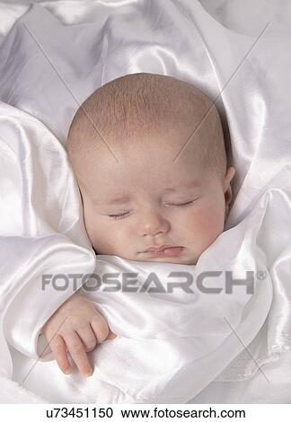 Stock Image - Sleeping baby boy, aged 7 weeks.. Fotosearch