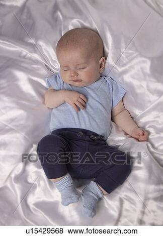 Stock Photo - Sleeping baby boy, aged 7 weeks.. Fotosearch