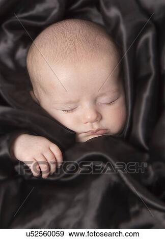 Stock Photo - Sleeping baby boy, aged 7 weeks.. Fotosearch