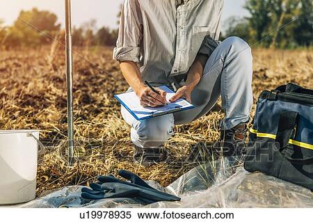 Soil Test. Female agronomist taking notes in the field. View Large Photo Image Stock Photography - Soil Test. Female agronomist taking notes in the field.. Fotosearch