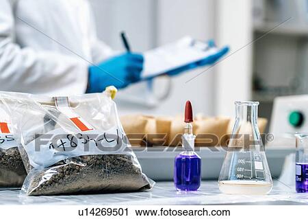 Soil testing laboratory work. Close up image of female scientist wearing white coat taking notes in laboratory View Large Photo Image Stock Image - Soil testing laboratory work. Close up image of female scientist wearing white coat taking notes in laboratory. Fotosearch