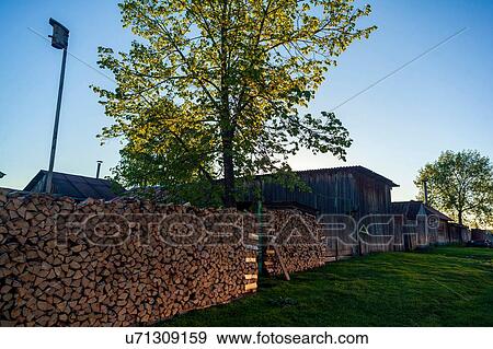 Stock Photo - Stacks of firewood on farm, Ural, Sverdlovsk, Russia. Fotosearch