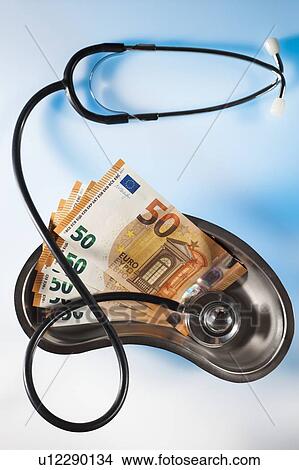 Stethoscope and money depicting medical costs in Europe. View Large Photo Image Picture - Stethoscope and money depicting medical costs in Europe.. Fotosearch