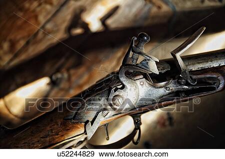 Stock Photo - Still life of a flintlock rifle from 1824.. Fotosearch