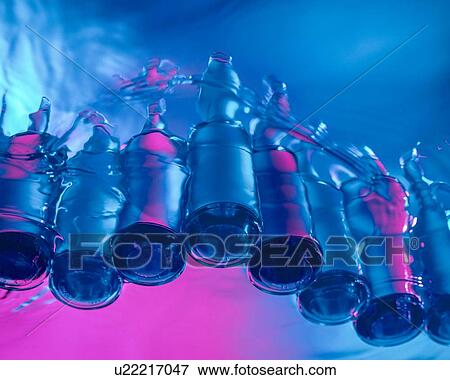 Stock Photo - Still life of newly made glass bottles. Fotosearch