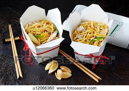Stock Image - Still life with chinese noodles in takeaway boxes, asian takeaway food. Fotosearch