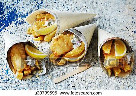 Stock Photography - Still life with fish and chips in cones. Fotosearch