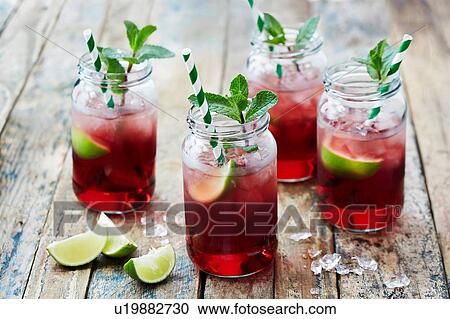 Still life with fruit cocktails in jars with drinking straws View Large Photo Image Stock Image - Still life with fruit cocktails in jars with drinking straws. Fotosearch