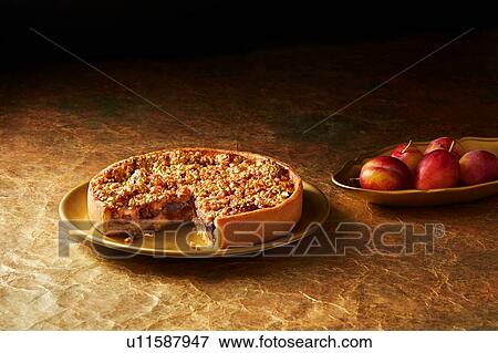 Still life with plum and almond tart on gold plate, christmas dessert View Large Photo Image Stock Photo - Still life with plum and almond tart on gold plate, christmas dessert. Fotosearch