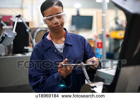 Student operating machine in workshop View Large Photo Image Picture - Student operating machine in workshop. Fotosearch