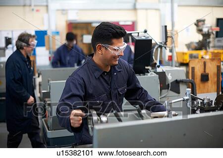 Student operating machine in workshop View Large Photo Image Stock Image - Student operating machine in workshop. Fotosearch