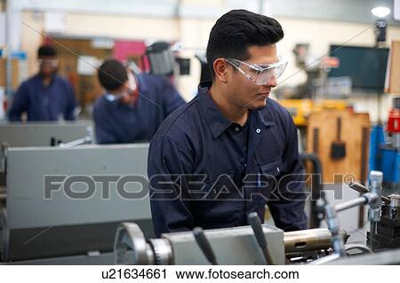 Student operating machine in workshop View Large Photo Image Stock Image - Student operating machine in workshop. Fotosearch