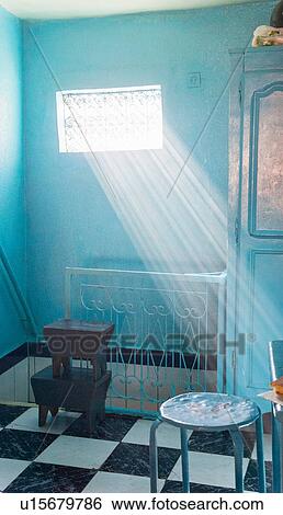 Sunrays coming in through window View Large Photo Image Stock Photograph - Sunrays coming in through window. Fotosearch