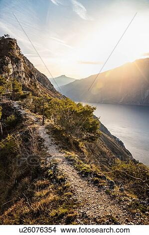 Sunrise over lake Garda from the western side - above Limone sul Garda, Lombardia, Italy View Large Photo Image Picture - Sunrise over lake Garda from the western side - above Limone sul Garda, Lombardia, Italy. Fotosearch