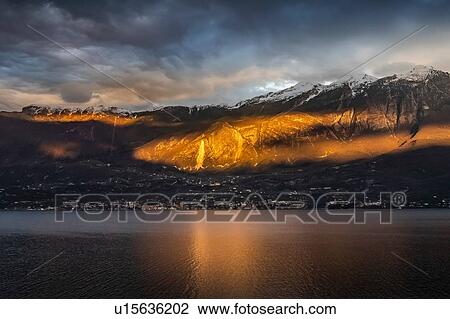 Stock Image - Sunset at lake Garda, Limone sul Garda, Lombardia, Italy. Fotosearch