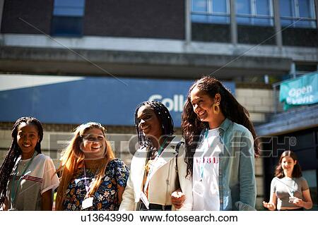 Teenage girl with young female higher education students leaving college campus View Large Photo Image Stock Image - Teenage girl with young female higher education students leaving college campus. Fotosearch