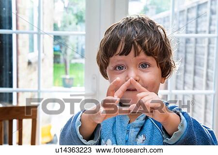 Toddler boy making shapes with his fingers View Large Photo Image Stock Image - Toddler boy making shapes with his fingers. Fotosearch