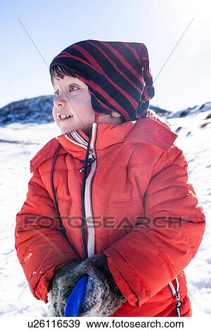 Stock Photo - Toddler boy playing in snow, Piani Resinelli, Lombardy, Italy. Fotosearch
