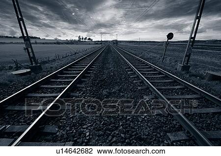 Stock Image - Train track stretching towards the horizon.. Fotosearch