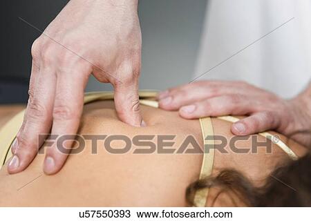 Stock Image - Trigger point therapy. Fotosearch