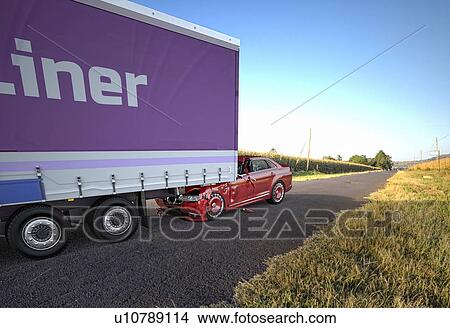 Picture - Two cars accident. Crashed cars. A red car against the back of a big truck. Big damage. On the road on location in country side. Perspective view.. Fotosearch