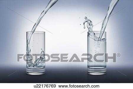 Stock Photo - Two glasses with pouring water, one full with splash and one less full. Side view on grey background.. Fotosearch