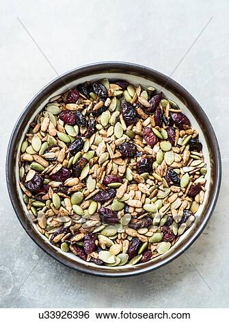 Variety of seeds and dried cranberries in bowl View Large Photo Image Stock Photograph - Variety of seeds and dried cranberries in bowl. Fotosearch