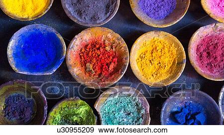 Stock Photo - Vibrant pigment powder in clay dishes. Fotosearch