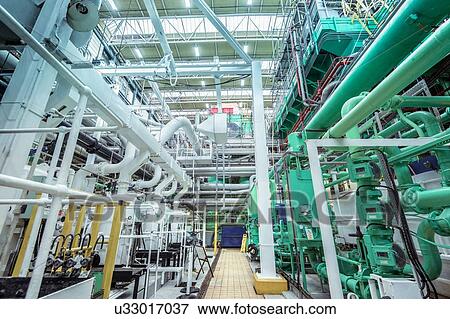 Stock Photo - View of turbine hall in nuclear power station. Fotosearch