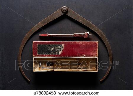 Stock Photo - Vintage hand saw blade in box, overhead view. Fotosearch